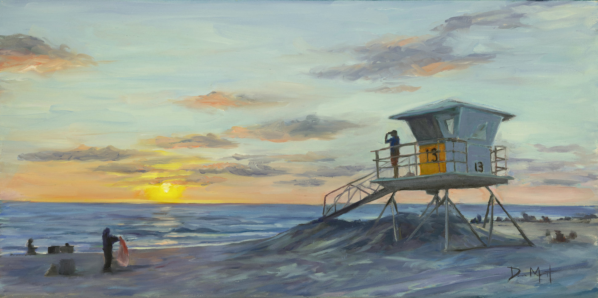 Lifeguard tower on beach at sunset. 